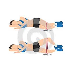 Woman doing Resistance band clam shells exercise. photo