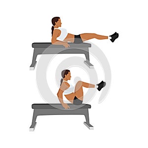 Woman doing Seated Bench leg pull ins. Flat bench