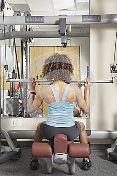 Woman doing seated exercises at the gym