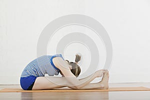Woman Doing Seated Forward Bend