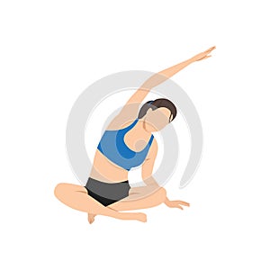Woman doing seated side bend pose parsva sukhasana exercise photo
