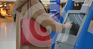 Woman doing self-check in at the airport