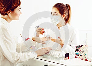 Woman doing shellac manicure