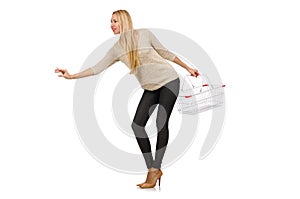 Woman doing shopping in supermarket isolated