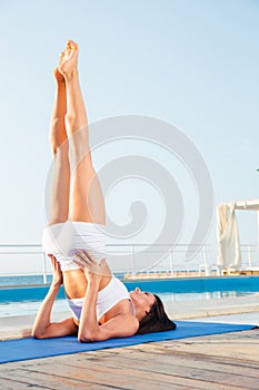 Woman doing a shoulder stand