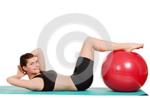 Woman doing sit ups with exercise ball