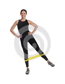Woman doing sportive exercise with elastic band on white background