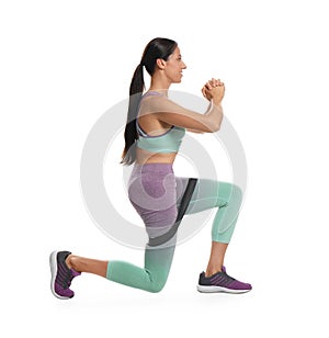 Woman doing sportive exercise with fitness elastic band on background