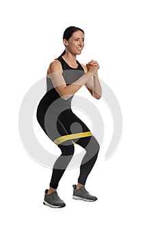 Woman doing sportive exercise with fitness elastic band on white background