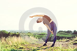 Woman doing sports outdoors on the hill