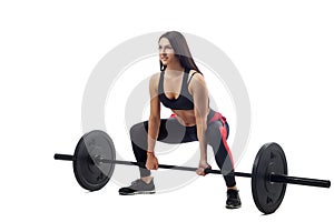 Woman doing squat with barbell