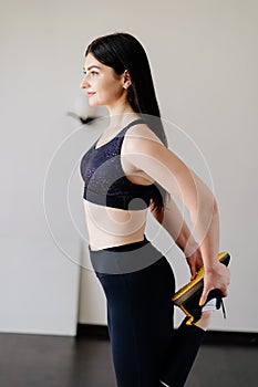 Woman doing stretching exercise warming up muscles