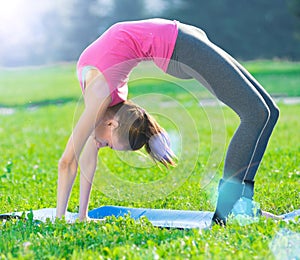 Woman doing stretching fitness exercise. Yoga postures