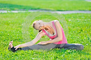Woman doing stretching fitness exercise. Yoga postures