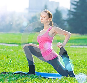 Woman doing stretching fitness exercise. Yoga postures