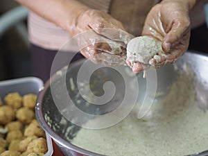 Woman doing Stuffed Dough Pyramid Dessert, Stuffed Dough Pyramid, year cake, Chinese New Yearâ€™s cake, dessert Made with