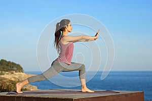 Woman doing tai chi exercise on the beach
