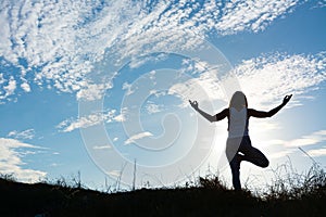 Woman doing the tree pose