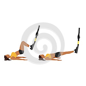 Woman doing TRX Suspension strap hamstring.