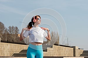 Woman doing warm up before workout on street