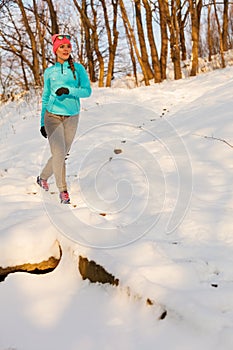 Woman doing winter jog in morning