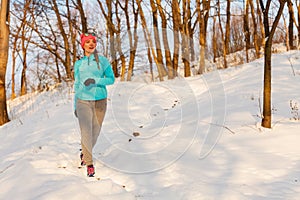 Woman doing winter jog in morning