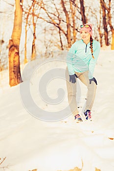 Woman doing winter jog in morning