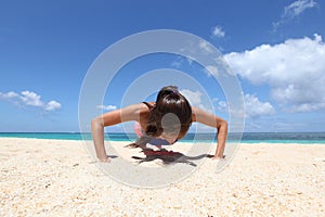 Woman doing workout on beach