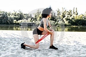A woman doing workout with a resistance band