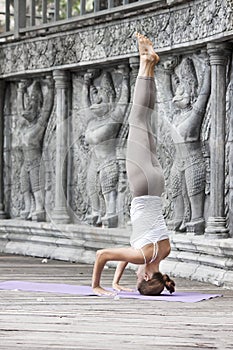 Woman doing yoga in abandoned temple