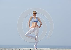 Woman doing yoga balance exercise