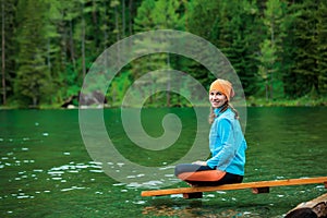 Woman is doing yoga excercises in Altai mountains