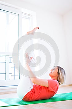 Woman doing YOGA exercise at home