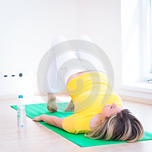 Woman doing YOGA exercise at home