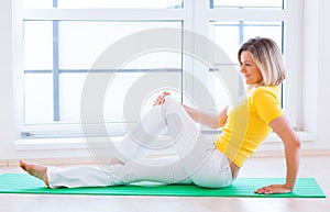 Woman doing YOGA exercise at home