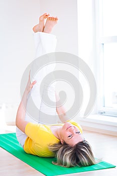 Woman doing YOGA exercise at home