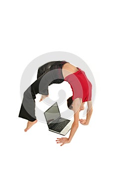 Woman doing yoga with laptop