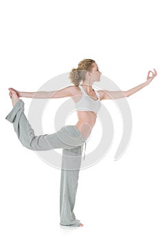 Woman doing yoga, Lord of Dance/Natarajasana pose photo