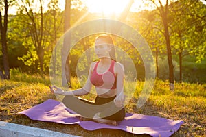 Woman is doing yoga meditation in nature