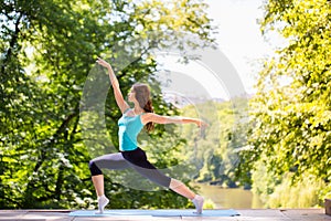 Woman doing yoga outdoors.