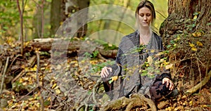 Woman doing yoga pose in the forest