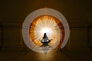 Woman doing yoga positions and meditating photo