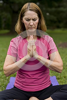 Woman doing yoga or praying