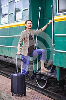 Woman at the door of an old railcar