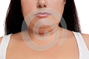 Woman with double chin on white background