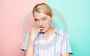 Woman doubtful face bites finger while thinking. Need time to make decision. Full of doubts. How to avoid mistakes. Girl