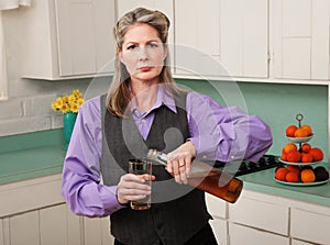 Woman in drag pouring a drink