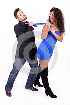 Woman dragging a man with his tie