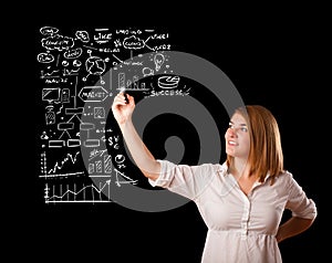 Woman drawing business scheme and icons on whiteboard