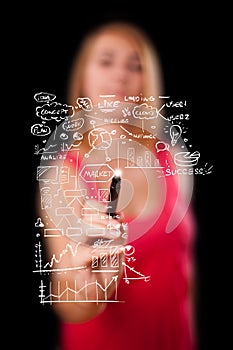 Woman drawing business scheme and icons on whiteboard